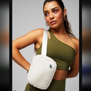 The Fabletics Belt Teddy cream white fleece outer shell bag